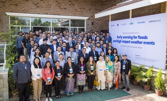 Group photo taken at ICIMOD beside banner for Knowledge Forum