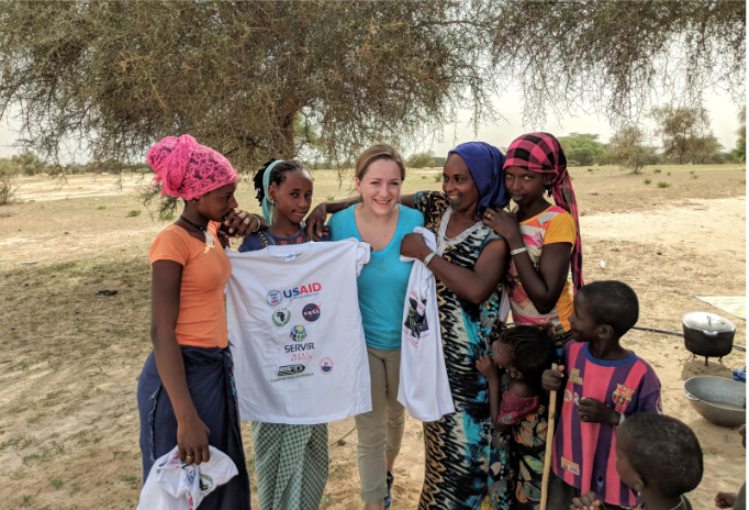 Rebekke Muench with group of pastoralists, women and children