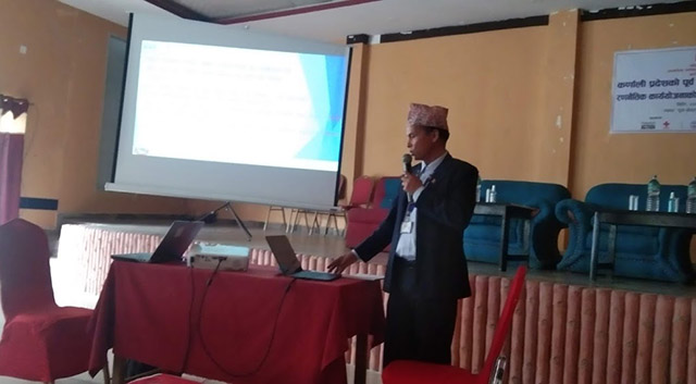 Photo of Secretary Punya Bikram Poudel giving presentation