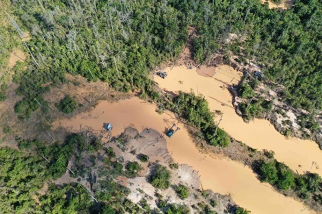 Aerial view showing deforestation around gold mining site