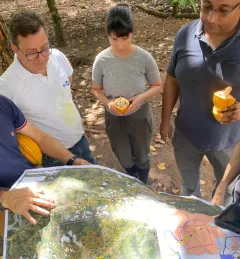 AST Pinto and partners looking at map